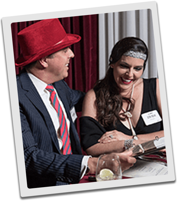 Baltimore Murder Mystery couple checking out the dinner menu